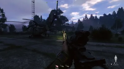 A player advancing through an industrial yard while operating a drone